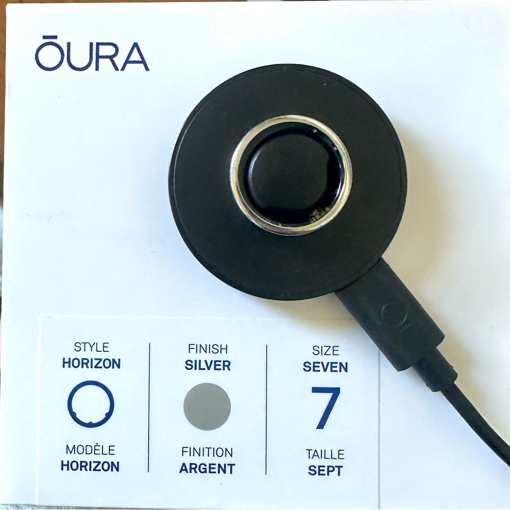 Oura Ring Charging Puck in Black with Silver Accent